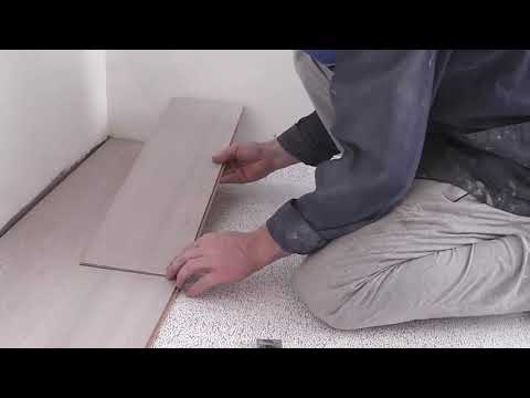  . How a Russian man puts laminate flooring.